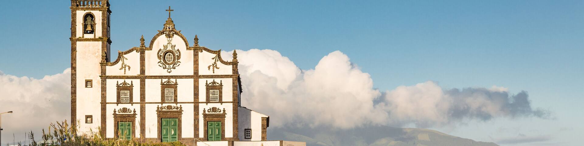 Church on the seafront town of Sao Rogue on Sao Miguel Island. Sao Miguel is part of the Azores archipelago in the Atlantic Ocean.; Shutterstock ID 663492832; Purchase Order: -
