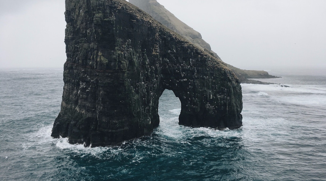 A little off-track route towards an fantastic rock in the ocean surrounded by massive cliffs and a steep island behind it.
The scenery is just stunning for photography or just be blown away its beauty (and the winds). Be carefull with the steep cliffs.
On the hike back we were followed all the time by a cute seal.
#hiking #nature #faroeislands #drangarnir #vikings #earth #places
Feel free to follow my travels on:
https://www.facebook.com/ShotByCanipel/
https://www.instagram.com/canipel/