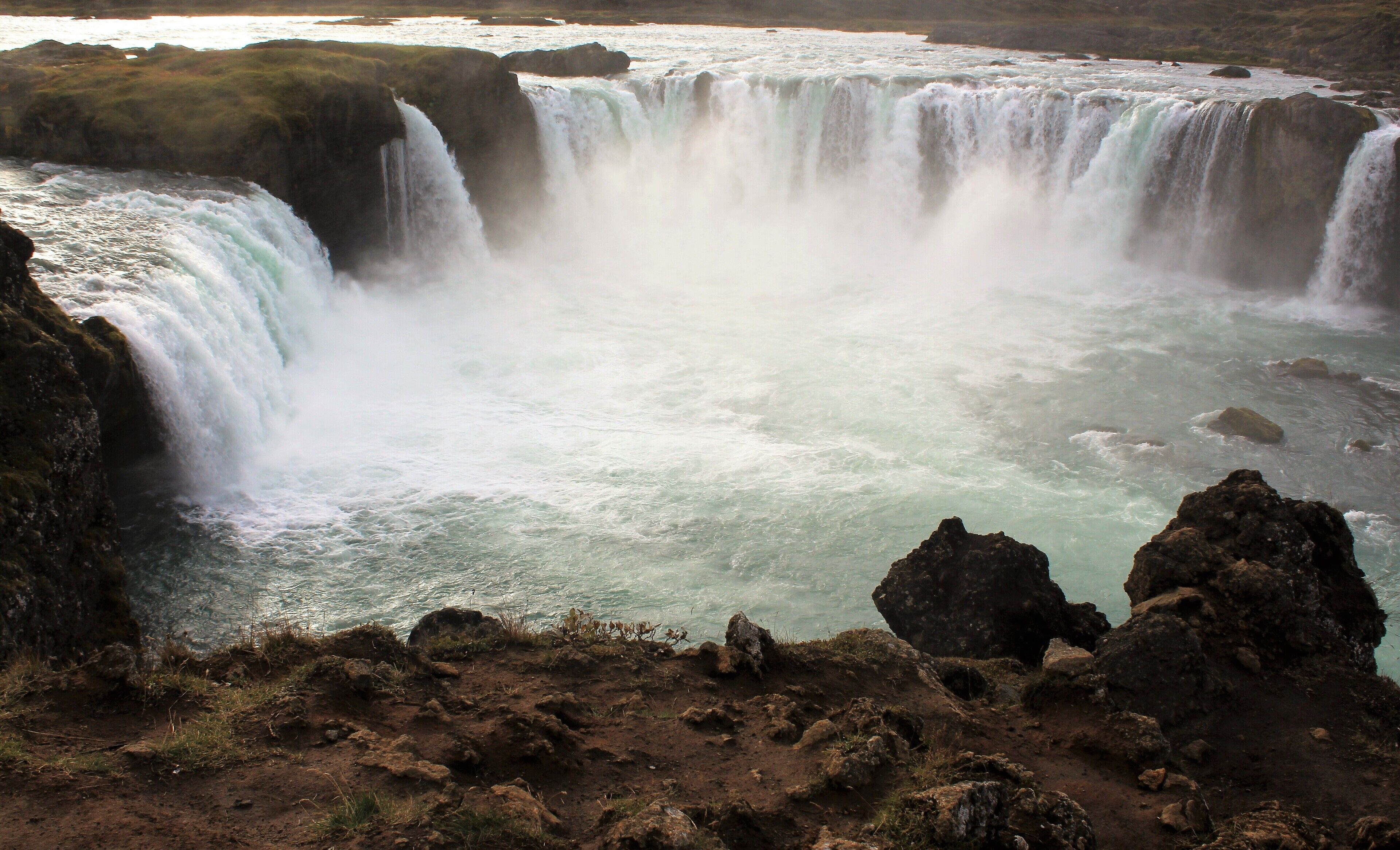 Goðafoss ('Waterfall of the Gods'), in north Iceland. This is my very favorite waterfall! And it's especially breathtaking from this viewpoint. I visited Goðafoss 3 times on that trip and this photo is from my last visit. I'm so glad I made that 3rd trip there! I didn't have much time as I had to catch the bus but I really tried to take it all in :). It really was a magic moment! And one I'll never forget. It was cold and rainy yet I felt mesmerized by the waterfall's beauty and majesty.