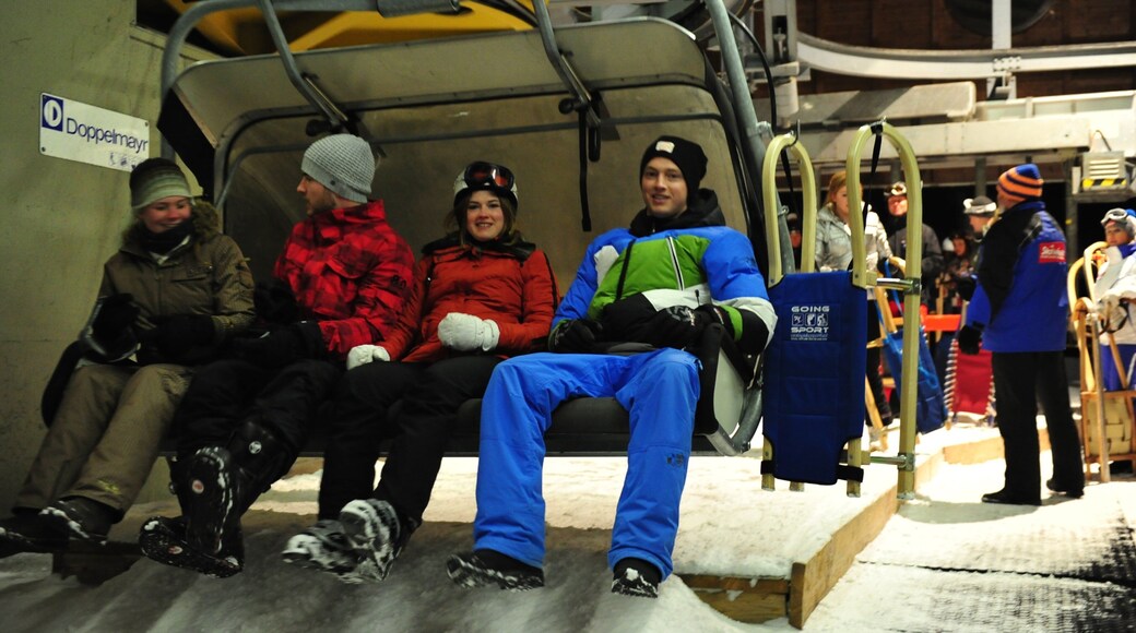 Going am Wilden Kaiser featuring a gondola and snow as well as a small group of people