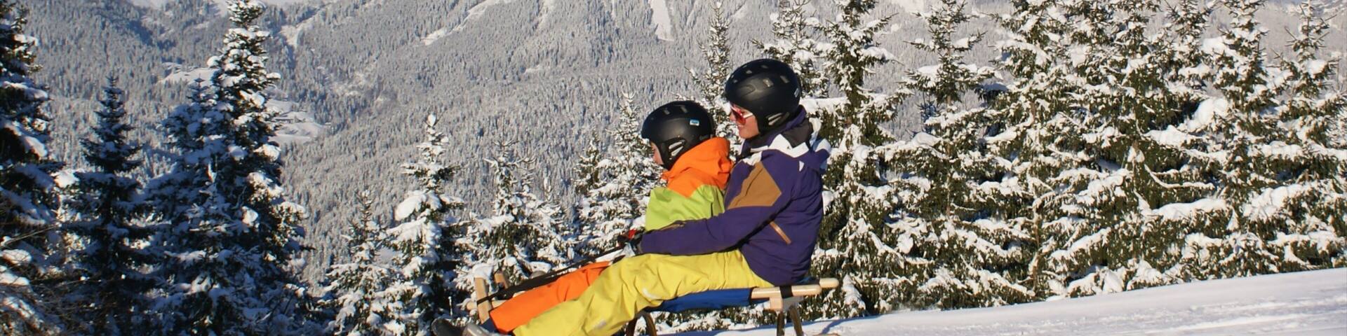 Going am Wilden Kaiser featuring snow, mountains and snow tubing