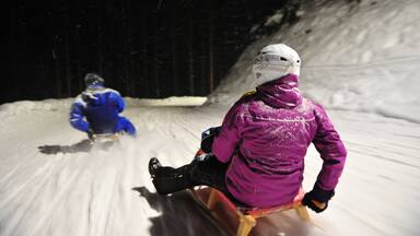 Going am Wilden Kaiser showing snow tubing, snow and night scenes