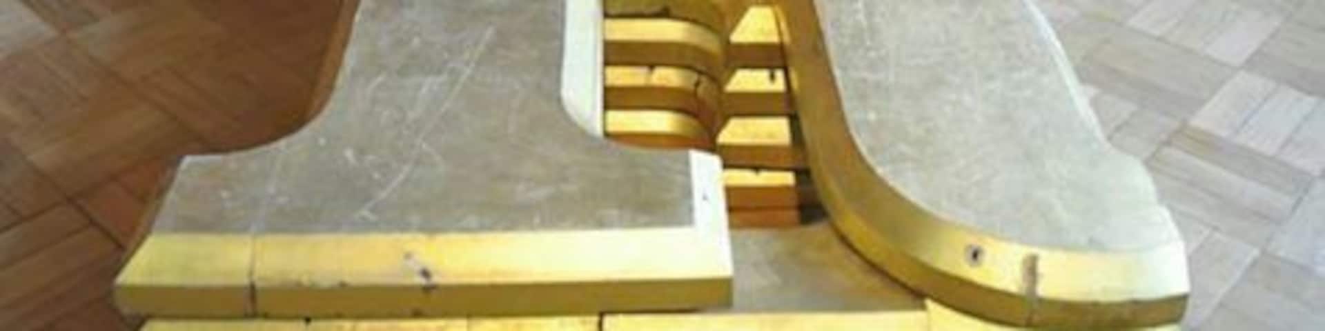 The old Tetley Brewery signage.
The Tetley Brewery was founded by Joshua Tetley in 1822, the Tetley name represents one of Leedsâ oldest manufacturing dynasties. For over 200 years the name Tetley has always had a strong link with the city.
Consequently the brewery site has important social and industrial significance and the brewery and its people have contributed greatly to the rich history of the city.
In 1822, Joshua Tetley leased a brewery in Salem Place, Hunslet for ÂŁ400. Joshua Tetley and Son was created in 1839 when Joshua made his son, Francis William a partner. Construction of a new brewery began in 1852 and by 1860 Tetley was the largest brewery in the North of England. By 1875, annual beer production had reached 171,500 barrels.
In 1931, the art deco Tetley headquarters building was erected. In 1954 Sheffieldâs Gilmour Brewery was acquired, along with 500 tied houses. Tetleyâs position as Leedsâ largest brewer was confirmed in April 1960 when it announced a takeover of Leedsâ Melbourne Brewery.
In 1961 Tetley merged with Ind Coope of Burton upon Trent and Ansells of Birmingham to form Allied Breweries, then the worldâs largest brewing conglomerate. At its height in the 1960s, the Leeds Brewery employed a thousand people. The brewery became the worldâs largest producer of cask ale during the 1980s. In 1998 Tetley was taken over by the Carlsberg Group.
The Leeds Brewery was closed in 2011, and demolished in 2012, with production contracted out by Carlsberg to breweries in Wolverhampton, Tadcaster and Hartlepool. Tetley retains its links to Leeds through sponsorship of its two main rugby teams Leeds Rhinos and Leeds Carnegie, and through The Tetley, which recently opened in November 2013, exhibiting up and coming artists.