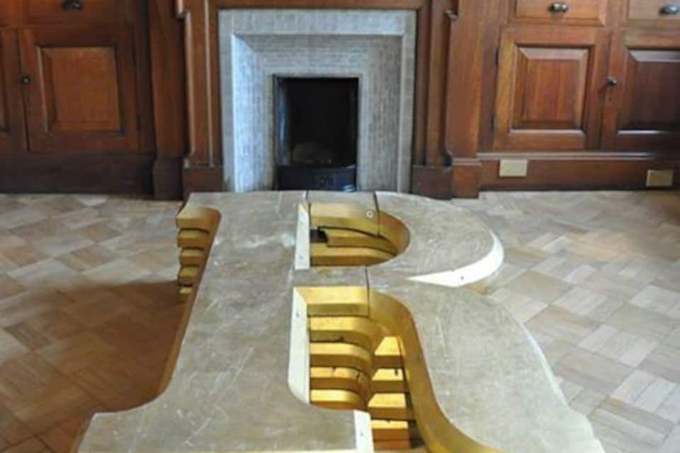 A large wooden cabinet with a fireplace in the center.