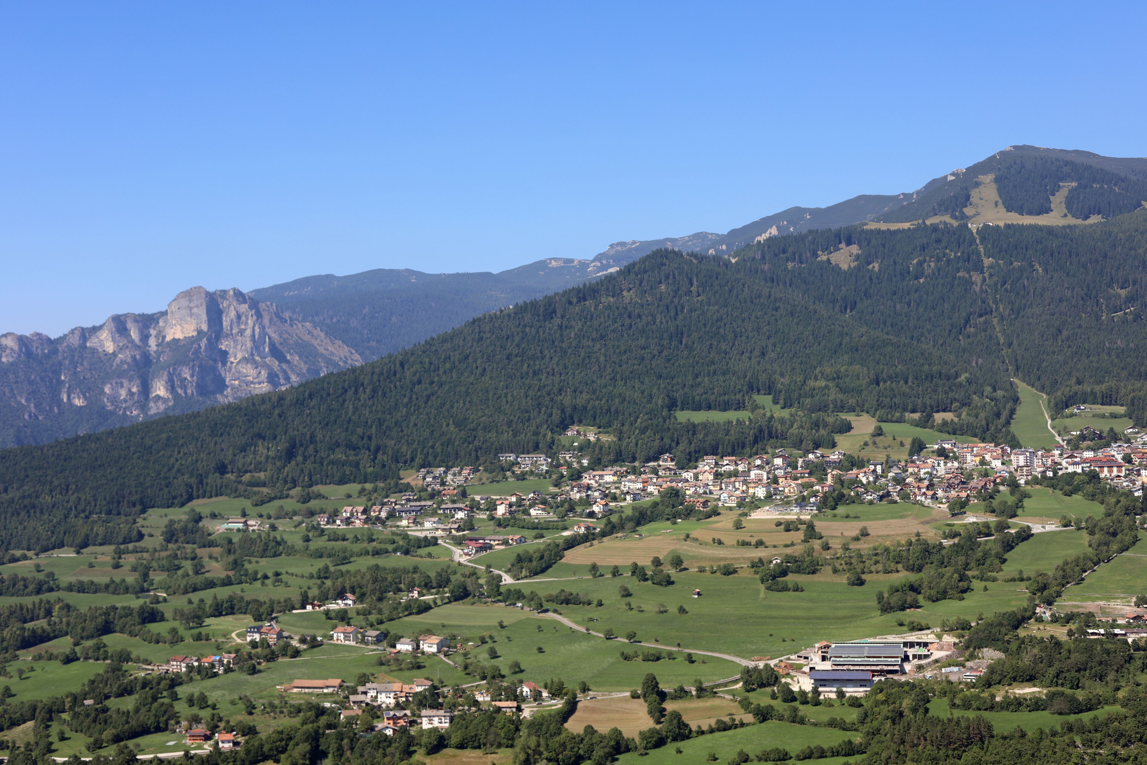 Panoramic view of the FOLGARIA Village in Northern Italy in Trentino Region and mountains called ALPE CIMBRA with trees
