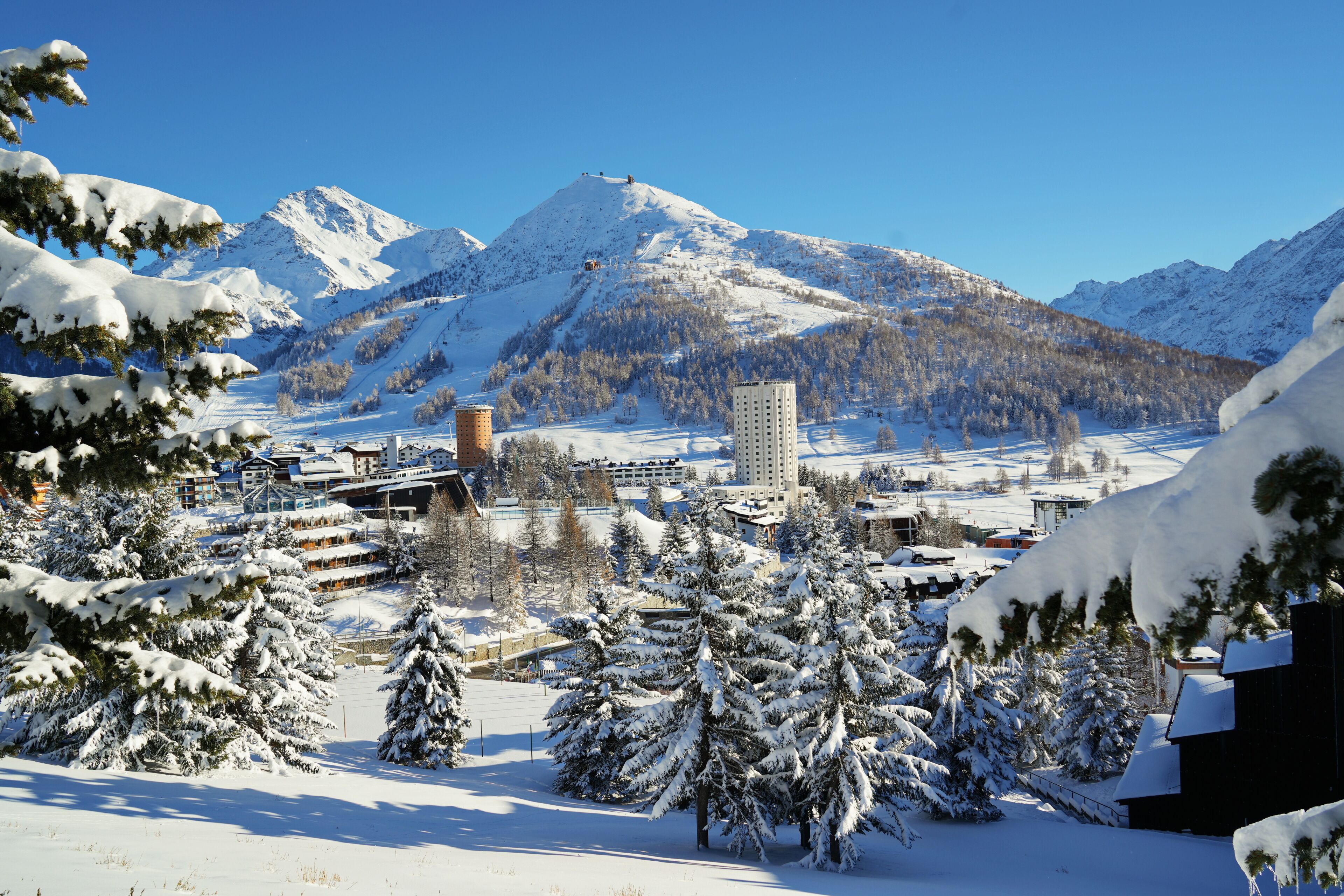 Overview of the snow-covered alpine village of Sestriere, which was the site of the Winter Olympics in 2006. Sestriere, Piedmont, Italy