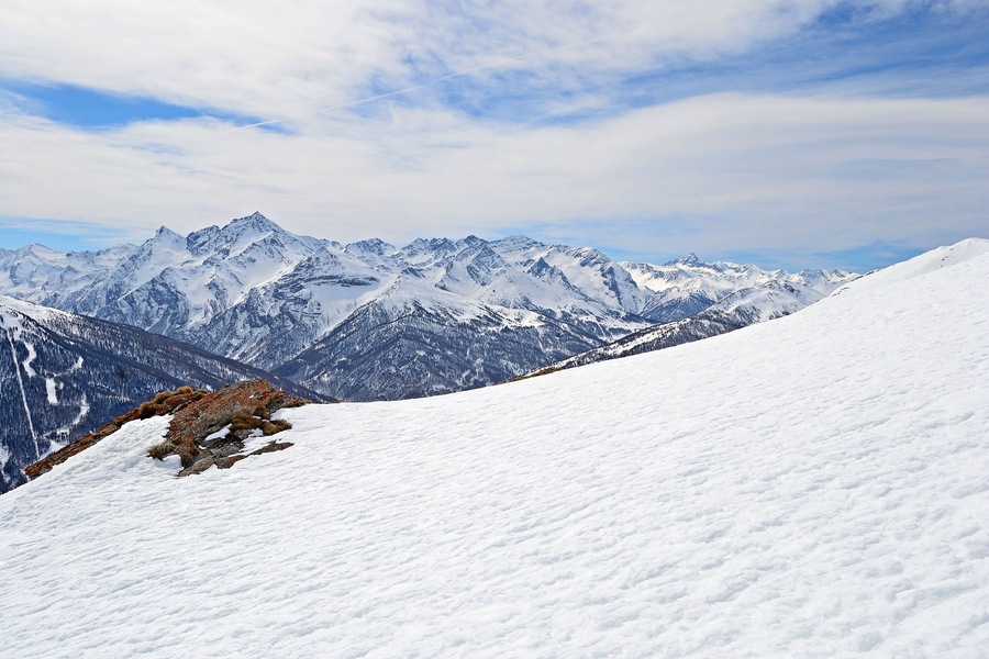 Majestic peaks in a winter scenery with Sestriere ski resort in the background,  Piedmont, italian Alps