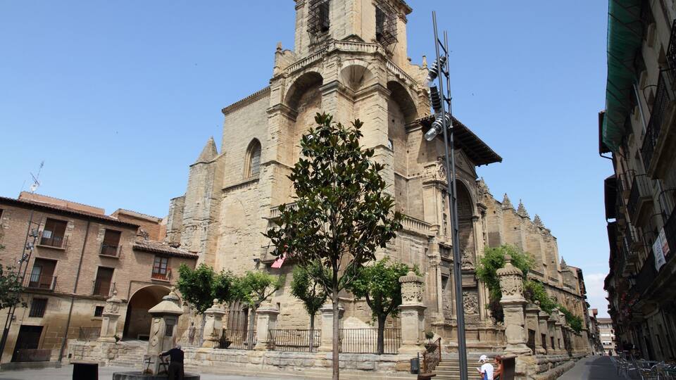 A historic church with a bell tower and arched windows.