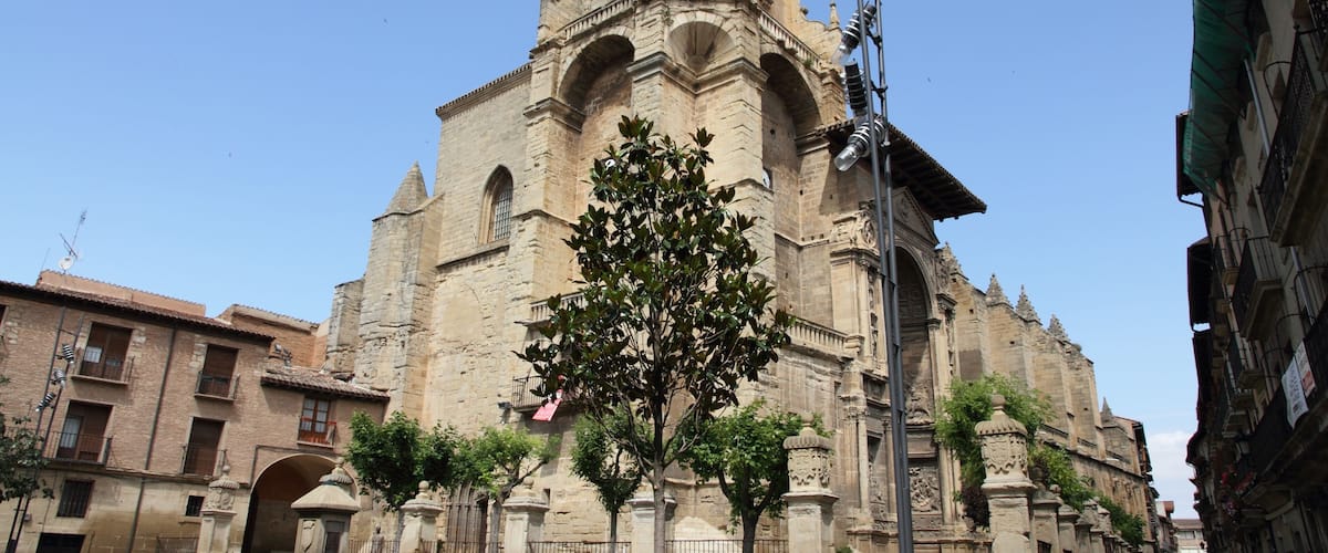 A historic church with a bell tower and arched windows.