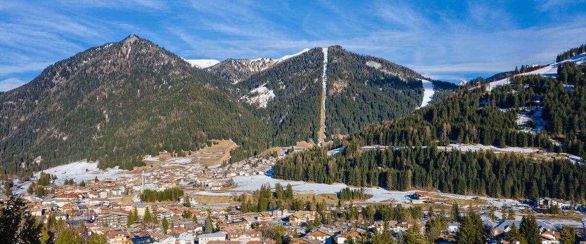 A mountainous landscape with a town nestled in the valley.