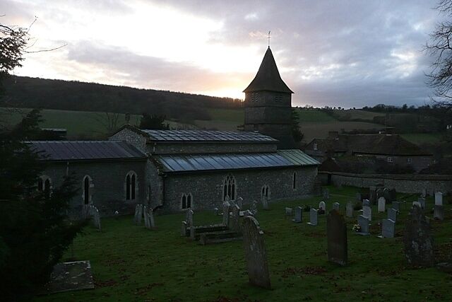 St. Peter's church, Hurstbourne Tarrant The north side from the steeply rising churchyard with the sun setting over Wallop Hill Down behind. The 17th century clerestory roof is clearly seen from this angle, as is the 15th century three-stage weatherboarded bell tower. There is more information here http://www.astoft.co.uk/hurstbourne.htm