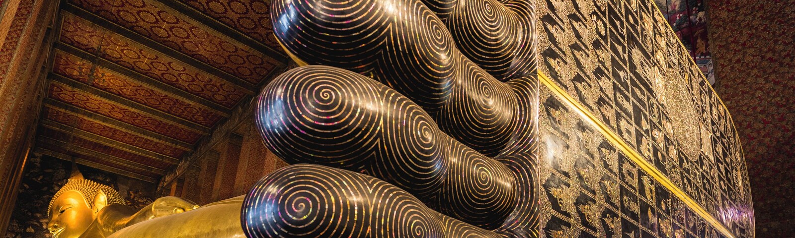 Trover #History Photo Challenge:
.
Thai Views | Wat Pho (Wat Pra Chetuphon): By far the most popular attribute of Wat Pho is the 150ft (46m) imagine of Buddha laying down, so popular that the temple is commonly referred to as The Temple of the Reclining Buddha. This image wasn’t always a part of the Wat Pho temple complex and wasn’t added until 1832 during the reign of King Rama III. The image, gilded in gold leaf is said to be a depiction of The Buddha in the last moments of Buddha’s life right before entering Nirvana, the end of the cycle of life, death and rebirth. It’s hard to capture in photography just how immense this image of Buddha is, the sole’s of Buddha’s feet measure 10ft (3m) high and 14.7ft (4.5m) long. Careful details adorn the soles of the feet with mother of pear inlays and auspicious symbols of Buddha. Anyone on the Buddhist path, literally have huge footsteps to walk in.
.
.
.
.
#sonyalpha #sonya7riii #travelblogger #travelvlogger #travelgoals #travelguide #wanderluster #wandering #instatravel #instavacation #natgeoyourshot #lpfanphoto #troveon #southeastasia #beautifulseasia #travelsoutheastasia #thailand #bangkok #igthailand #thailandinsider #amzthld #explorethailand #vistthailand #thailandtravel #watpho #buddhist #buddhism #buddhisttemple #buddha