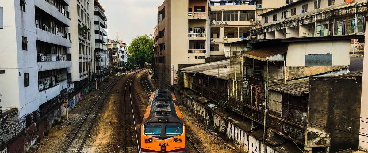 Street art and train. Over a bridge in Bangkok city