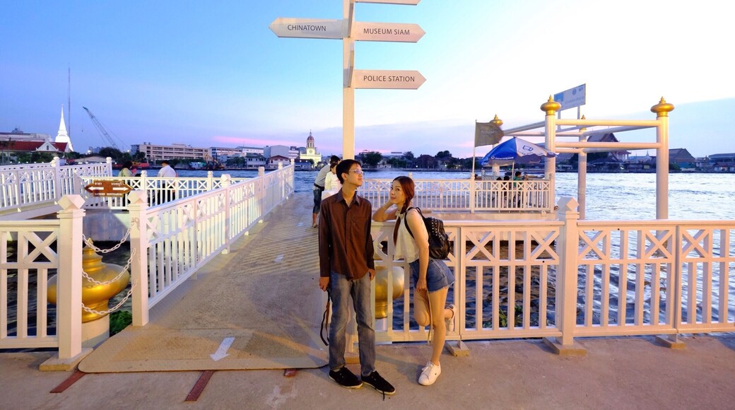 At the river side just before sunset.The sky is beautiful , people walking by , some are waiting for the boat , some are chatting , But I was taking pictures😃