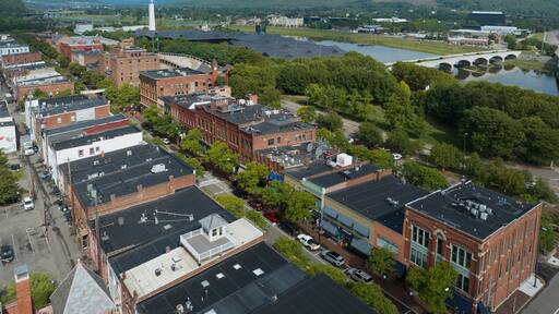 Aerial view of Corning Market Street downtown area with brick facade buildings next to the Glass factory