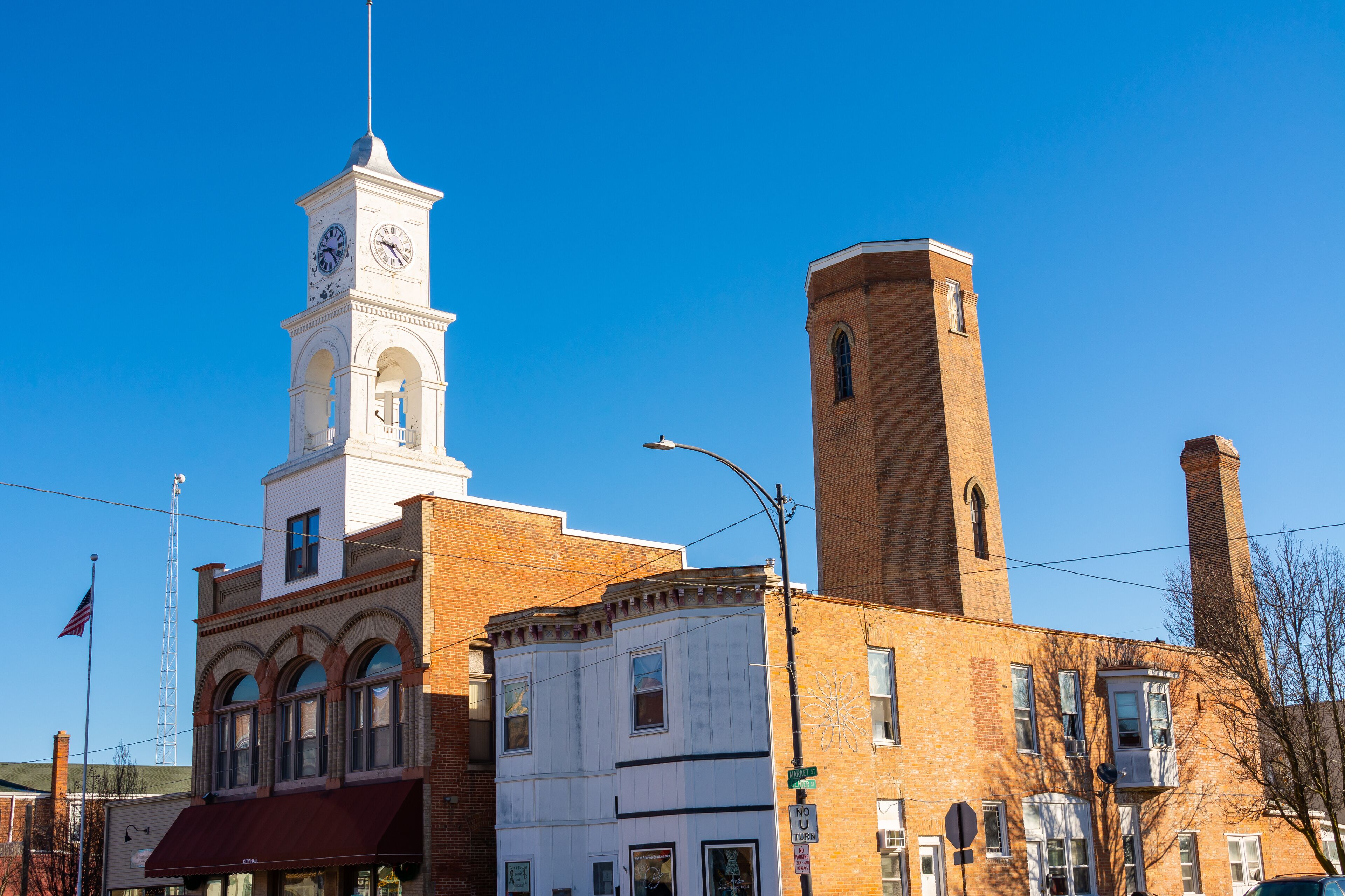 A historic building with a clock tower and a tall brick tower.