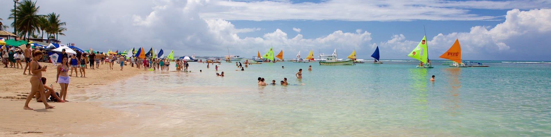 Porto de Galinhas which includes swimming, a sandy beach and general coastal views