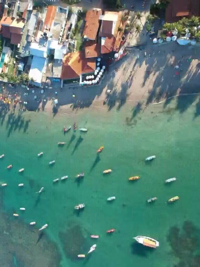The unbelivably blue and still sea does not look like it's only a two hour drive away from a state capital. One of the amazing things about Porto de Galinhas is how flat the seabed is, one could reach all boats in this picture before losing footing. And once you're in the water, it's so still you can swim with your eyes open without any sand or debris.  #LifeAtExpedia