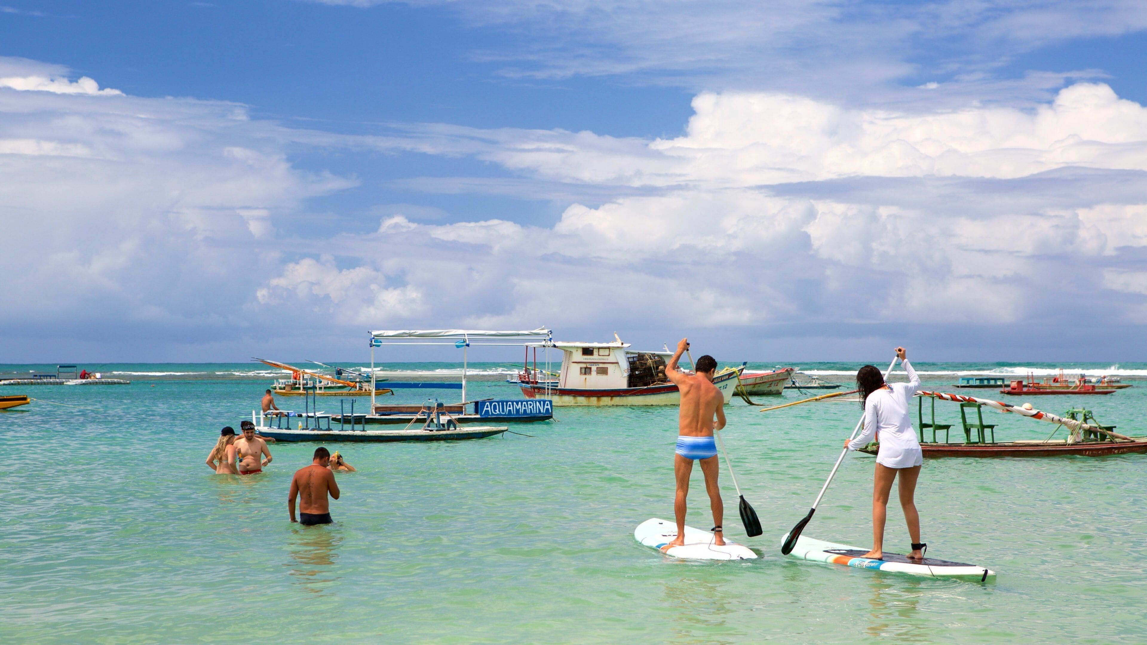 Porto de Galinhas which includes watersports, swimming and general coastal views