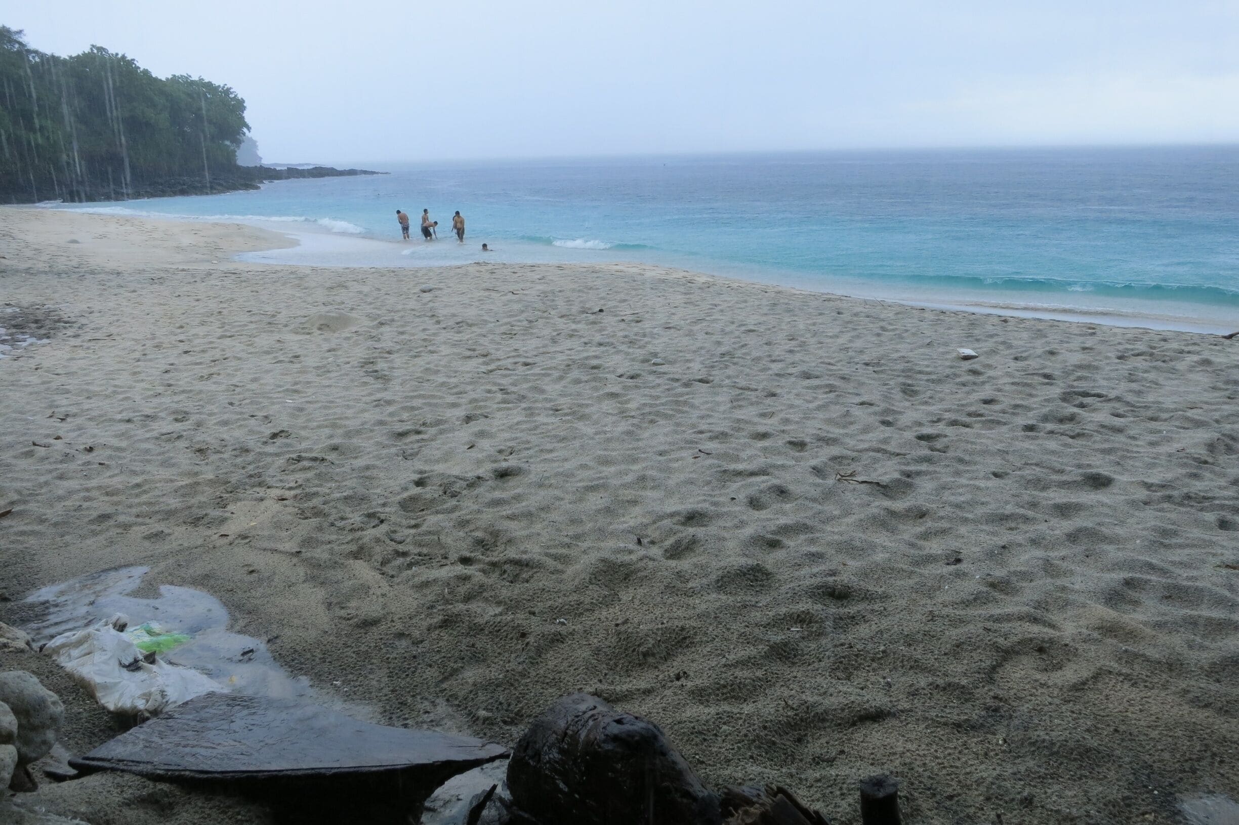 Padang Bai is a quiet little town in East Bali. There didn't seem to be a lot going on there other than diving, which is what I was there for.  But it was great!  Just what I was looking for.  For divers: good macro diving as well as some big stuff (white tip sharks, octopus, rays, eels etc.
This small bay just south of the main harbor provided a great, albeit small, beach called "white sand beach".  Good snorkeling.  The last warung stall had great ginger coffee!