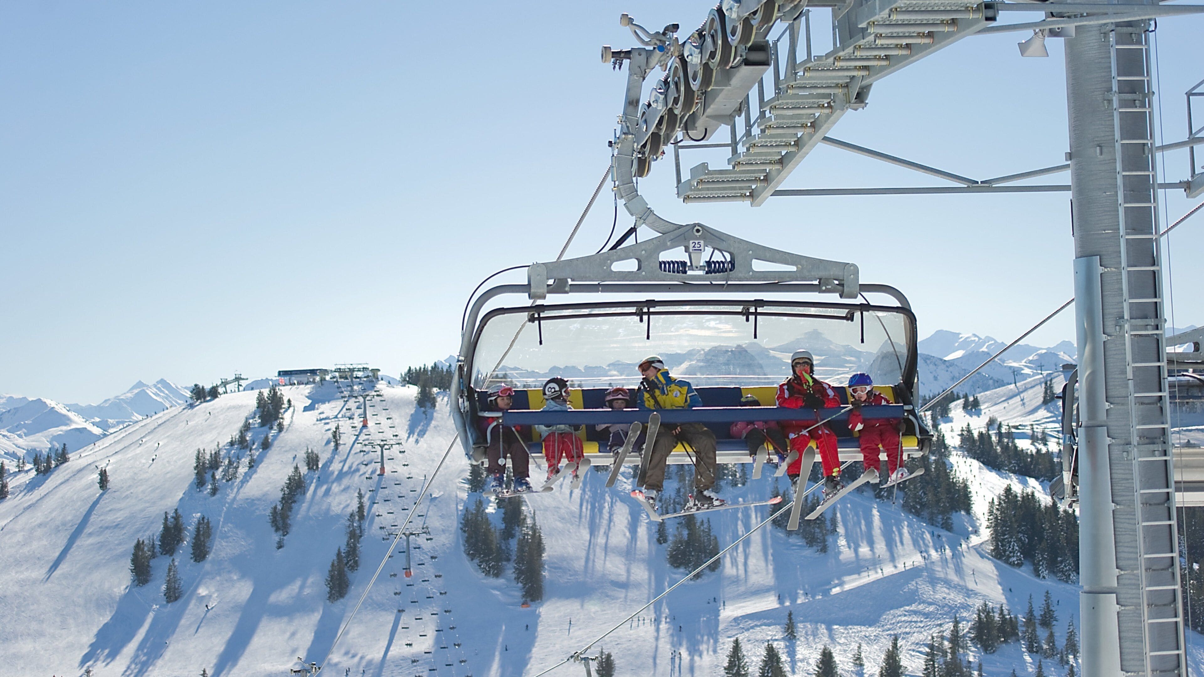 A ski lift with passengers.