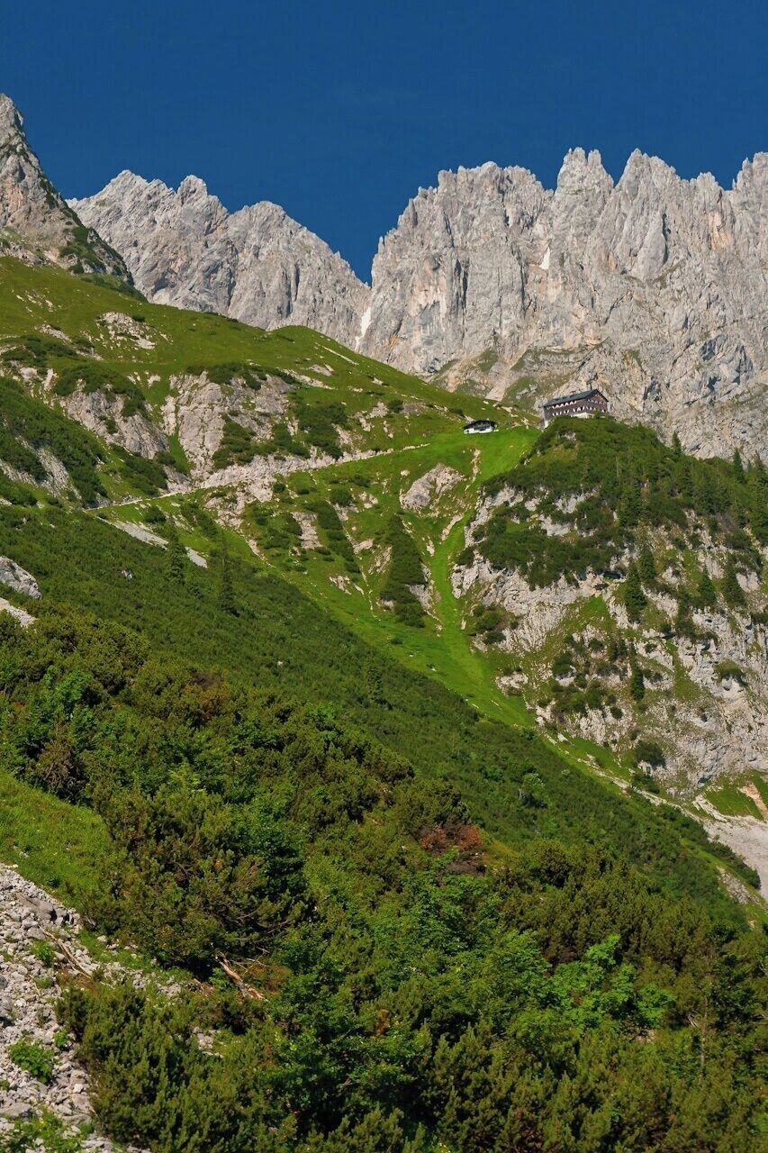 July, 2015

Gruettenhuette, Wilder Kaiser mountains, Austria 

Wilder Kaiser (=Wild Emperor) mountains belong to Northern Limestone Alps and stretch between the towns Kufstein and St. Johann in Tirol region of Austria. You will find green meadows and mountain pine forrests under the dramatic white walls of the main Wilder Kaiser range with summits from 2.000 to 2.344 metres (Ellmauer Halt as the highest). There are several huts on the south side of the range and Gruettenhuette (alt. 1.620 m) is one of them. 
Wilder Kaiser is the southern range of the Kaiser Gebirge (=Emperor's mountains) and it is the most visited climbing area in Austria. There are plenty of via ferrata routes here of different difficulty ranges, both for kids or experienced amateurs. 