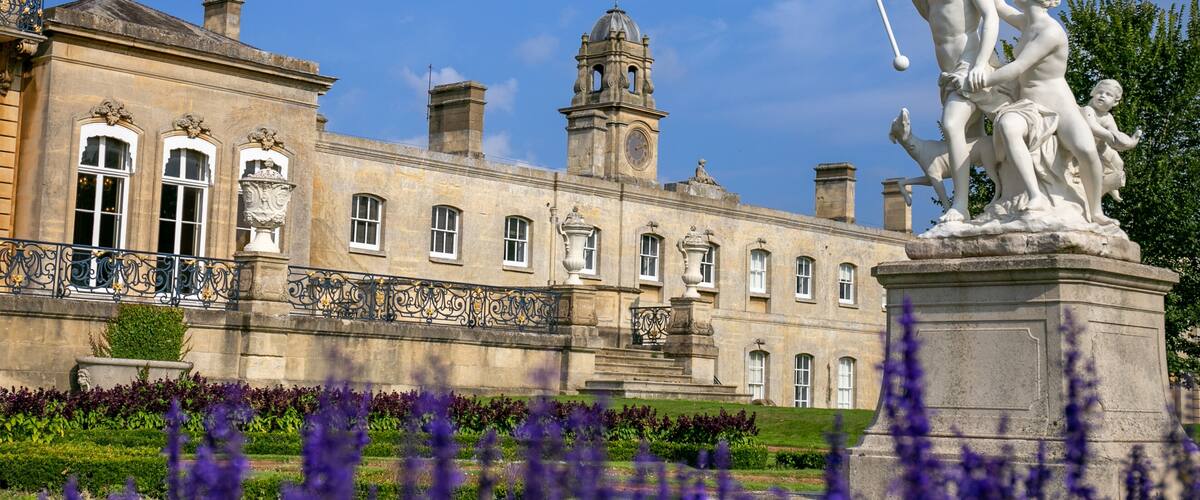 Historic country estate of Wrest Park in Bedfordshire, featuring the grand house constructed between 1834 and 1839 alongside landscaped gardens, a clock tower, and service buildings. Managed by EH