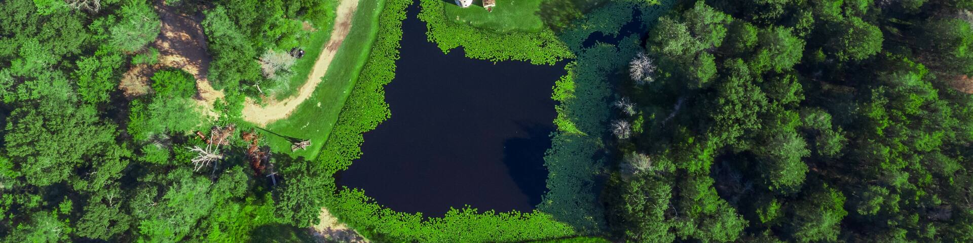 Drone view of Newman's Castle, a unique custom creation hidden just outside Bellville in the rolling countryside, TEXAS, USA.