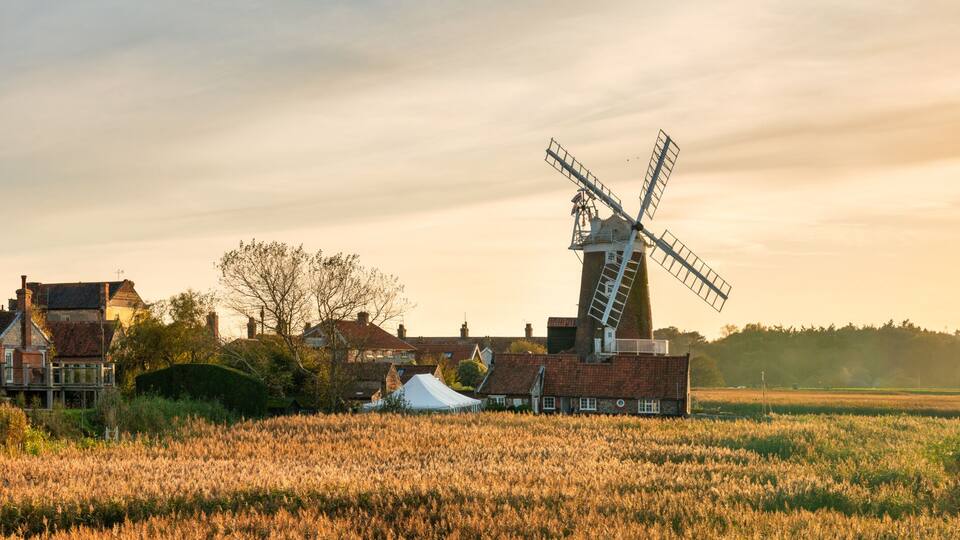 Cley Windmill at sunset in the village of Cley, Norfolk, UK