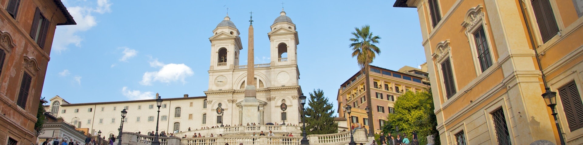 Vibrant crowds gather at Spanish Steps in Rome, enjoying the lively atmosphere and historic architecture