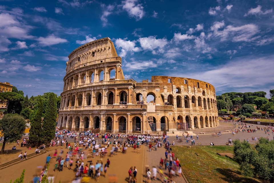 The Colosseum in Rome with tourists around.