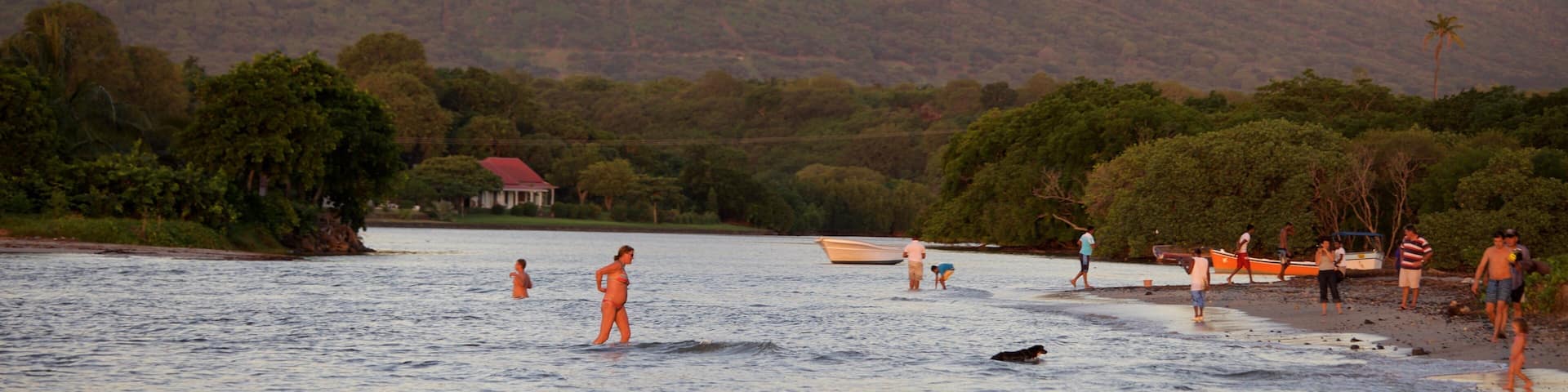 Tamarin featuring a sunset, swimming and mountains