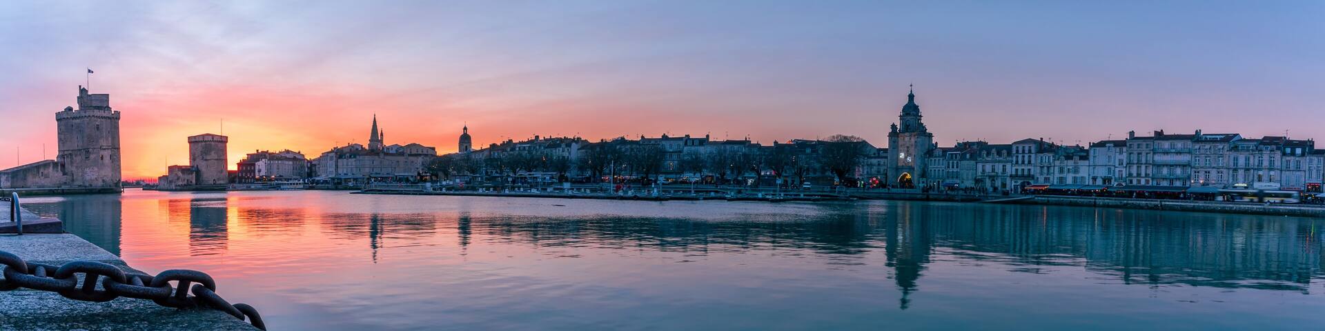 beautiful illuminated cityscape of the old harbor of La Rochelle