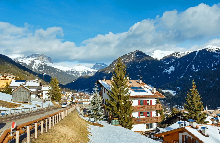 Beautiful winter mountain village. View from the Great Dolomites Road (Grande Giro  delle Dolomiti), South Tyrol Dolomites, Italy