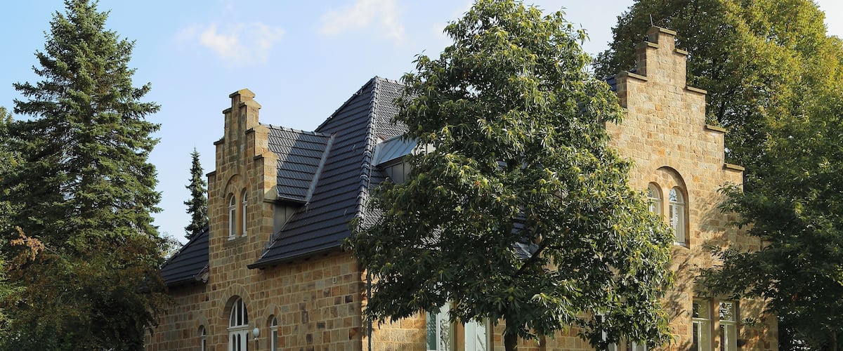 Former Protestant School (Alte Evangelische Schule) in Hörstel, Kreis Steinfurt, North Rhine-Westphalia, Germany. This sandstone building, 3 Westphalia Street (Westfalenstraße 3), is a listed cultural heritage monument.