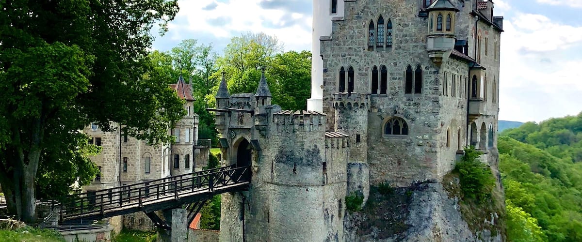 Lichtenstein Castle or Schloss Lichtenstein is a privately owned castle built in Gothic Revival style and located in the Swabian Jura of southern Germany. It was designed by Carl Alexander Heideloff and has been described as the "fairy tale castle of Württemberg." It overlooks the Echaz valley near Honau, Reutlingen in the state of Baden-Württemberg. The modern castle was inspired by the novel Lichtenstein (1826) by Wilhelm Hauff and was built in 1840-1842. The ruins of the medieval castle that inspired the novel are a few hundred meters away. The name Lichtenstein translates as "shining stone.