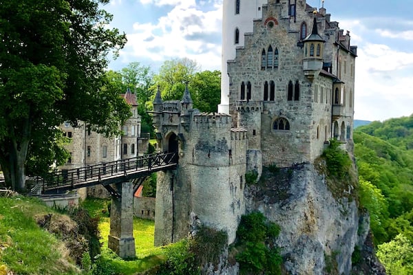 Lichtenstein Castle or Schloss Lichtenstein is a privately owned castle built in Gothic Revival style and located in the Swabian Jura of southern Germany. It was designed by Carl Alexander Heideloff and has been described as the "fairy tale castle of Württemberg." It overlooks the Echaz valley near Honau, Reutlingen in the state of Baden-Württemberg. The modern castle was inspired by the novel Lichtenstein (1826) by Wilhelm Hauff and was built in 1840-1842. The ruins of the medieval castle that inspired the novel are a few hundred meters away. The name Lichtenstein translates as "shining stone.
