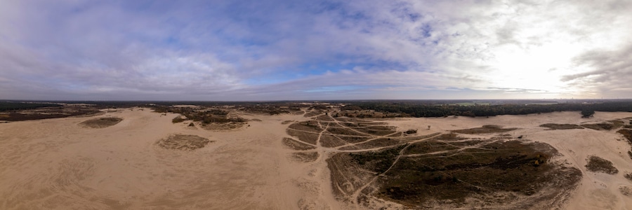 Super wide aerial panorama of Loonse en Drunense Duinen sand dunes in The Netherlands. Unique Dutch natural phenomenon of sandbank drift plain seen from above.