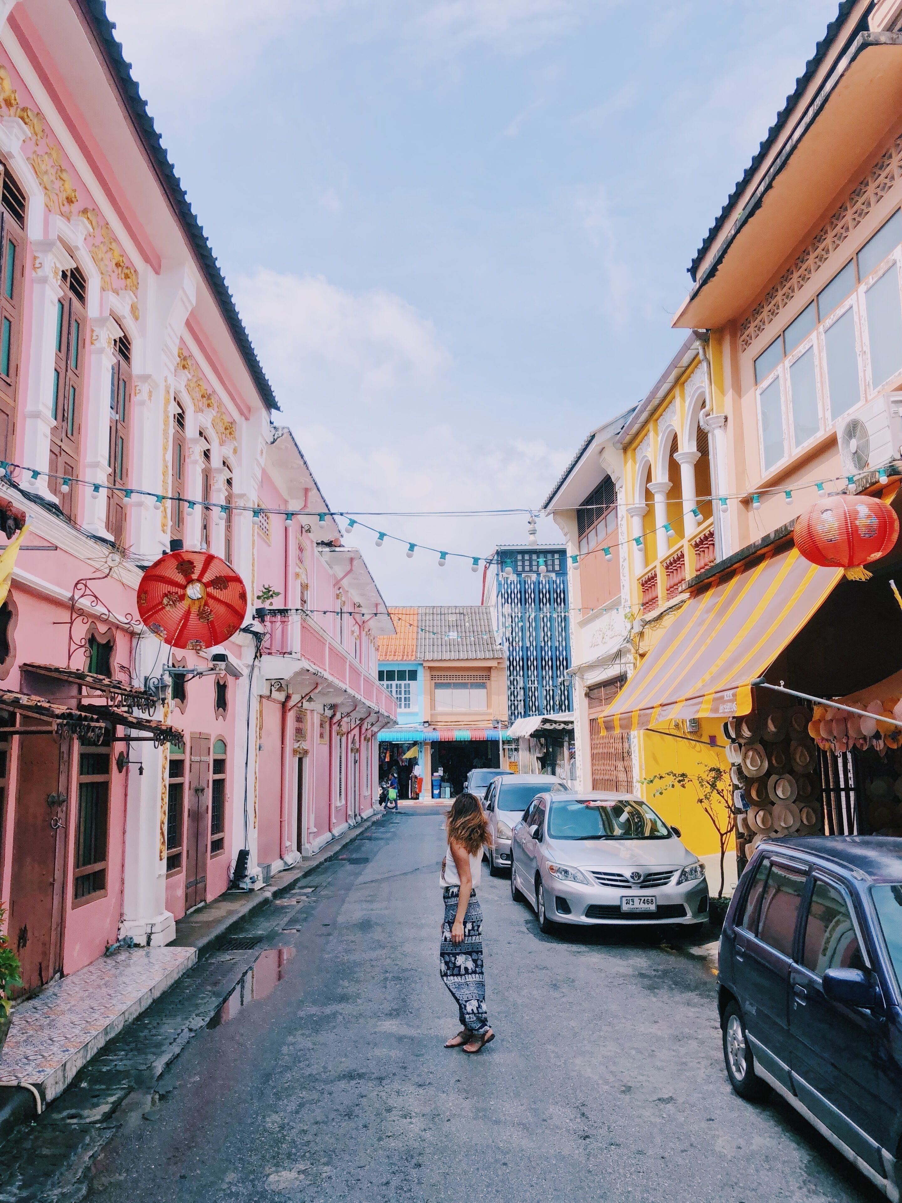 Exploring the streets of the charming Old Phuket Town. On the road to the town, we got soaking wet from the rain and I had to buy the touristy tank and these elephants pants to change into. Great memories from being #OnTheRoad in Thailand.