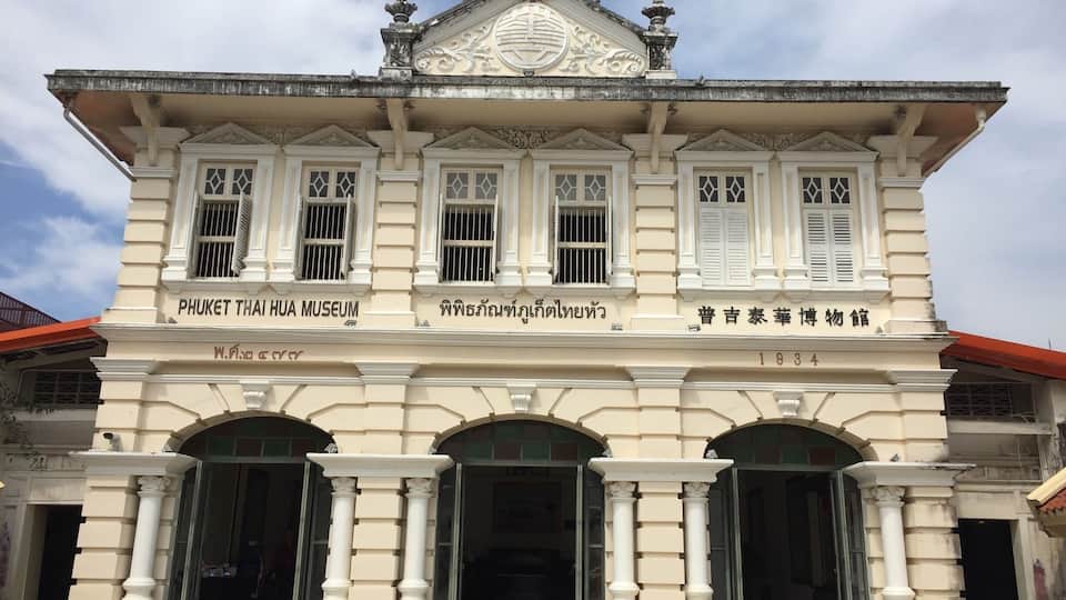 A historic building with ornate architectural details, including columns and decorative elements.