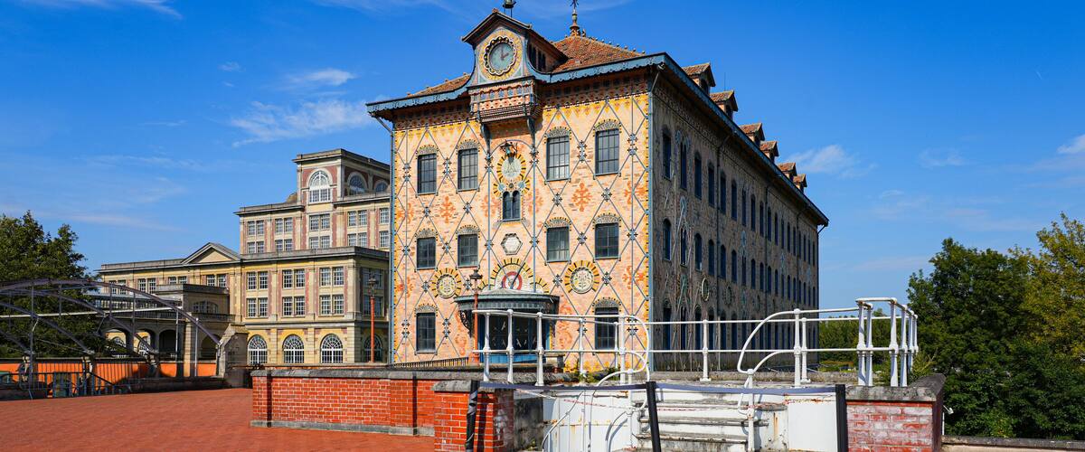 A historic building with ornate tilework and a clock tower.