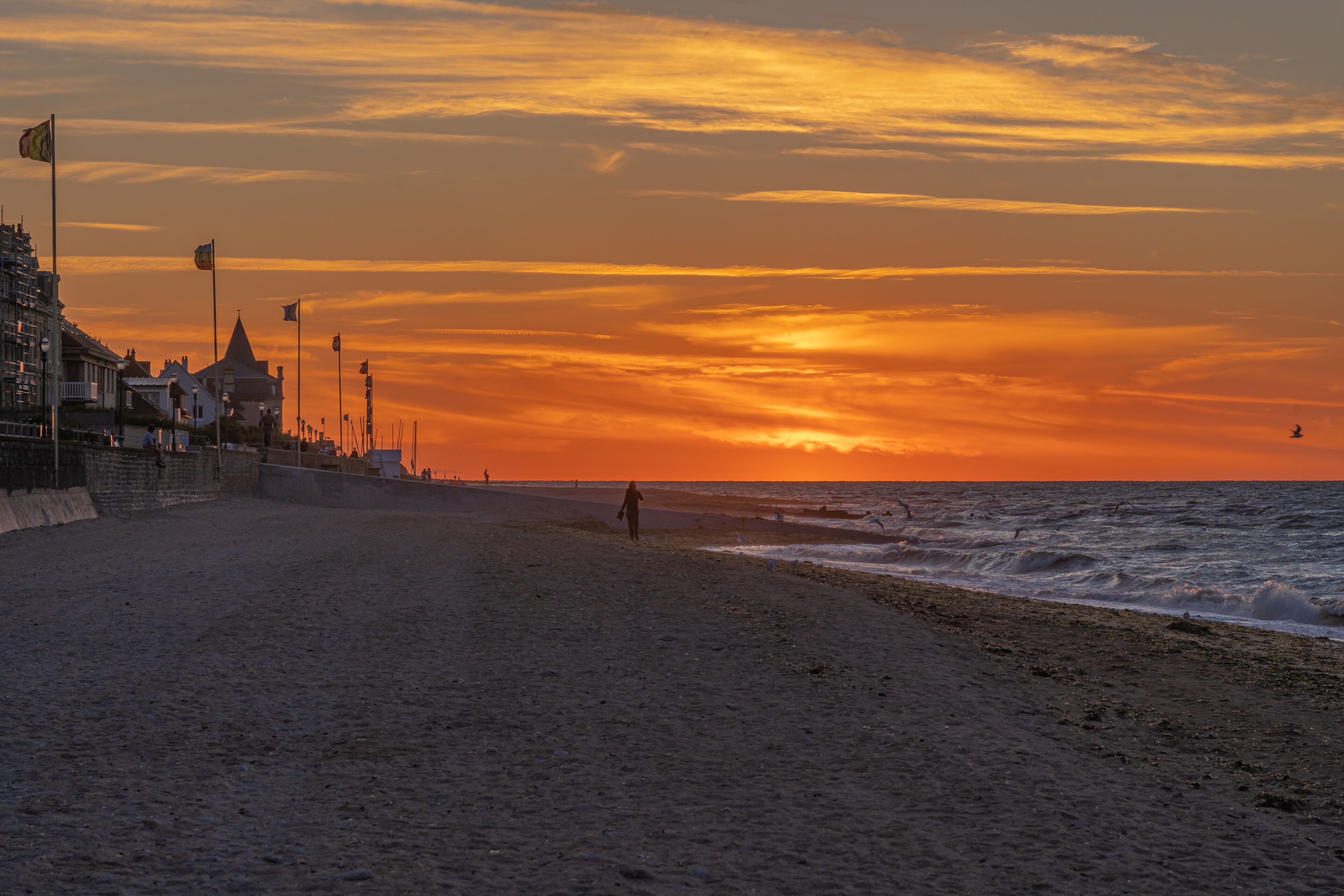 Langrune Sur Mer, France - 08 03 2020: Panoramic view of the sea from the beach at sunset