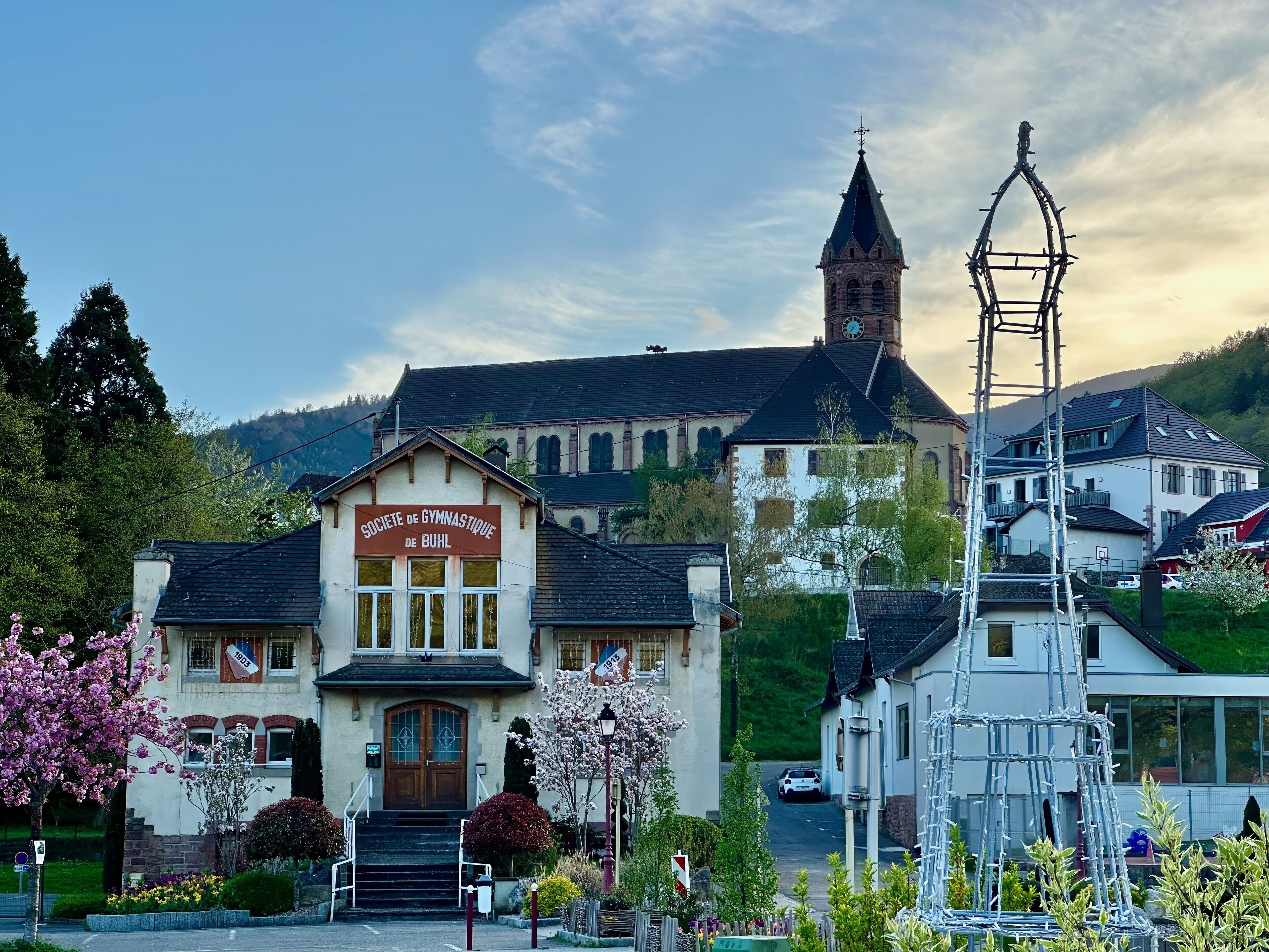 Quaint Buhl Village with Gymnastics Society Building and Eiffel Tower Sculpture, Alsace, France