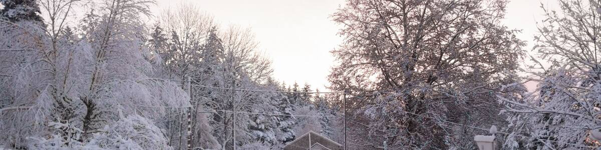 ice covered road going through a snowy French village