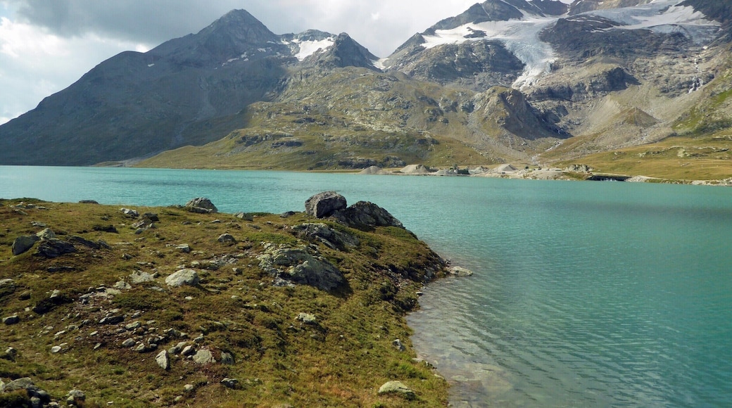 Lago Bianco is a reservoir at the Bernina Pass, Switzerland. Its elevation is 2,234 m (7,329 ft). The reservoir was formed by the two dams Scala and Arlas on the site of two natural lakes (Lago Bianco and Lago della Scala). The narrow-gauge rail track provides the highest regularly scheduled train service in Europe at this site. #GreatOutdoors