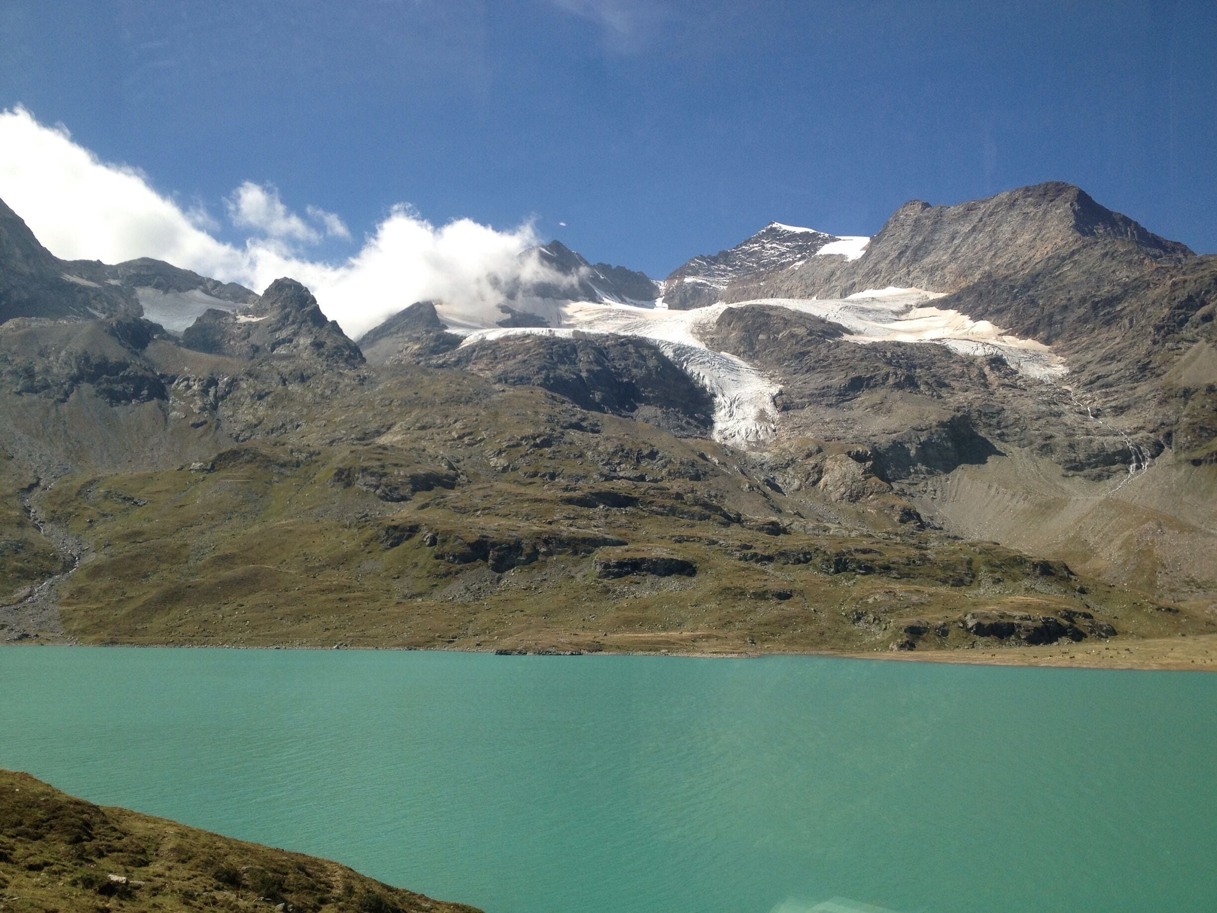 View of the Cambrena glacier and Lago Bianco from the Bernina Express at Ospizio Bernina :) 
