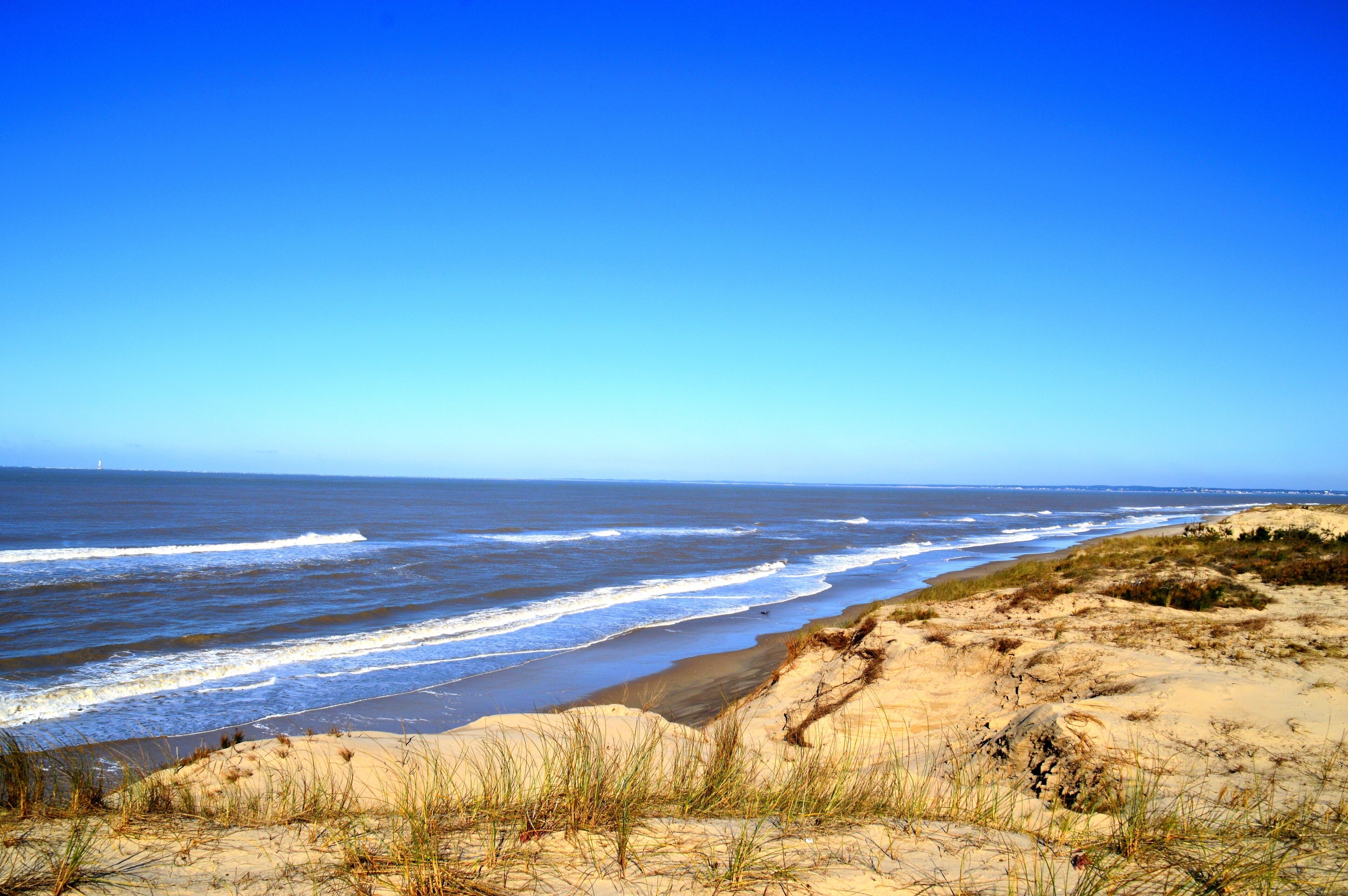 views of the dunes and the Atlantic Ocean in Soulac, Gironde, France; Shutterstock ID 386427628; purchase_order: SP-1332 HA Batch 2 August 2018; Order: ; client: HomeAway; other: To be paid with HA bu