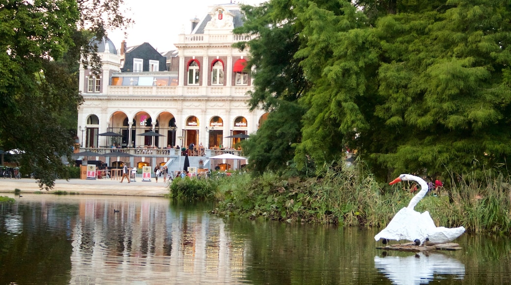 Vondelpark featuring a pond, bird life and heritage architecture