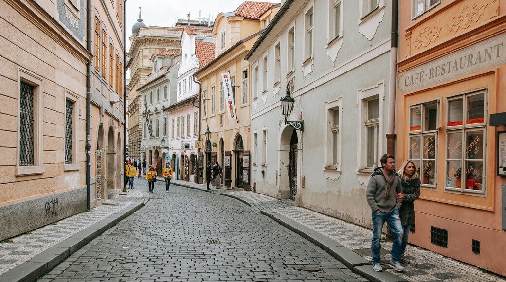 Mala Strana which includes street scenes and a city as well as a couple