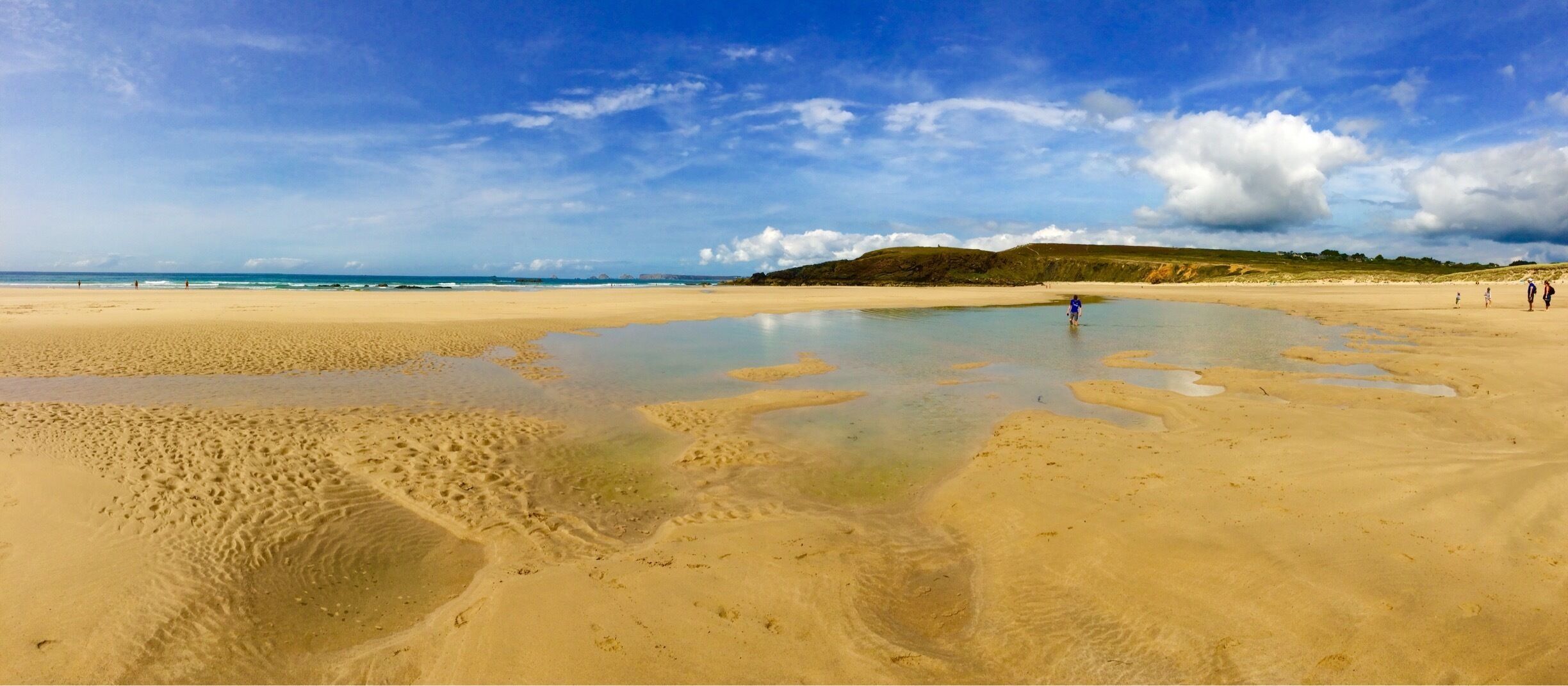 Surfers' beach - unsafe for swimming, but lots of people ignore this. Sand stretches forever at low tide. Walk uphill to see prehistoric standing stones. 